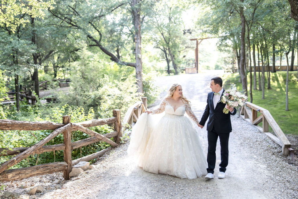 Trickle Creek Ranch wedding venue in Weatherford, Texas featuring a beautiful outdoor ceremony beneath a majestic oak tree just outside Fort Worth.