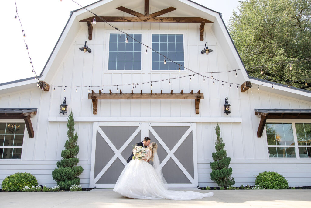 Scenic wedding portraits at Trickle Creek Ranch showcasing the property's spring-fed creek, towering oak trees, and beautiful Texas landscape.