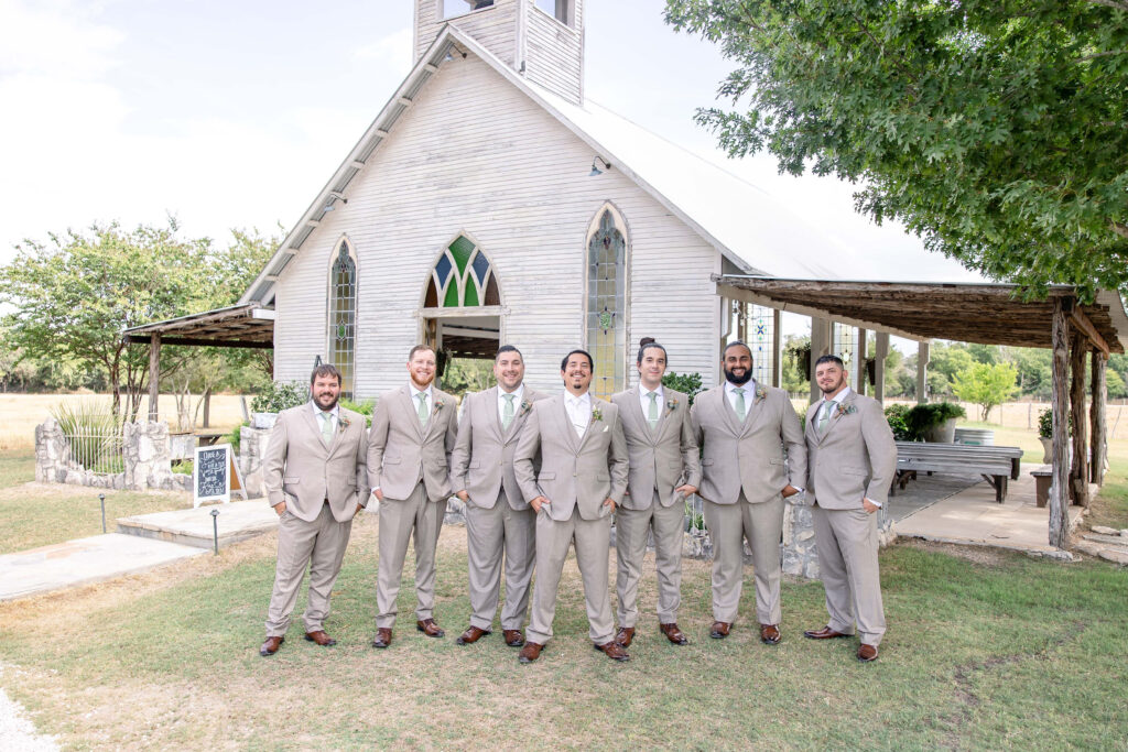 Outdoor wedding ceremony at Gruene Estate in Gruene, Texas showcasing the original open-air chapel and peaceful countryside setting.