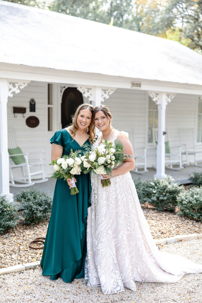 Reception tables beneath chandeliers inside Gruene Estate's covered pavilion in New Braunfels, Texas designed for unforgettable wedding celebrations.