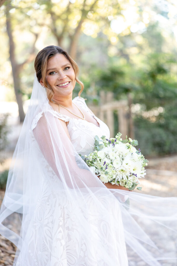 Sunset wedding portraits at Gruene Estate in the Gruene Historic District surrounded by rolling fields and iconic Texas Hill Country landscapes.