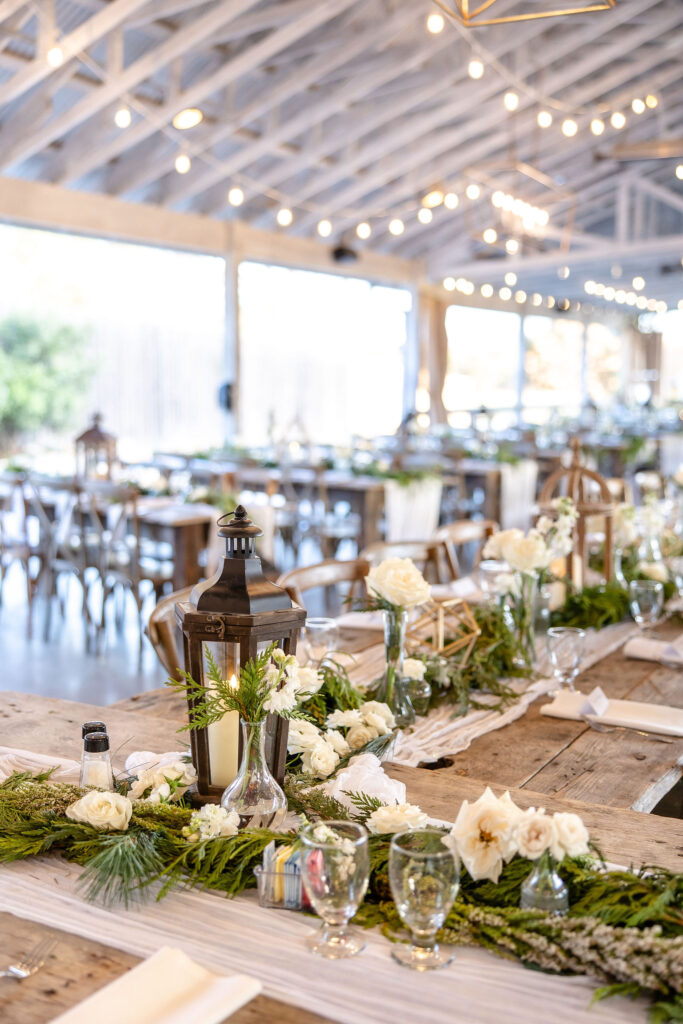 Elegant reception at Gruene Estate in New Braunfels, Texas featuring a modern farmhouse pavilion with rustic Hill Country charm.